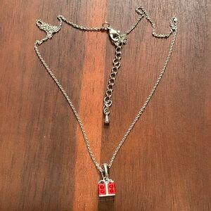 Silver tone red swarovski crystal present pendant necklace